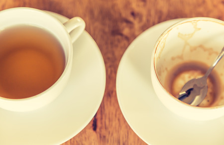 Empty cup of coffee on wooden table ( Filtered image processed vintage effect. )の写真素材
