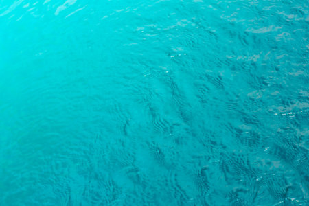 Blue swimming pool rippled water