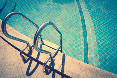 Swimming pool with stairs ( Filtered image processed vintage effect. )の写真素材