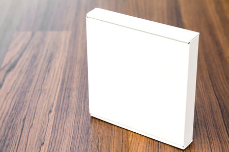 Blank white box mock up on wood background