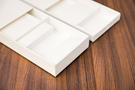 Blank white box mock up on wood backgroundの写真素材