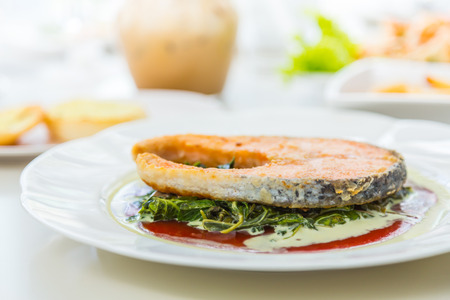 Grilled Salmon Steak with Spinachの写真素材