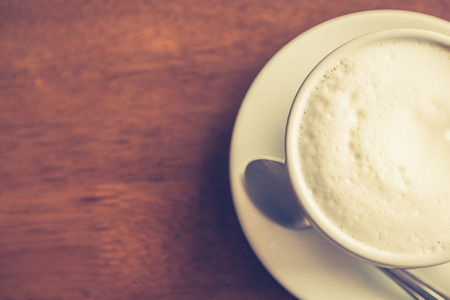 Hot latte art coffee on table ( Filtered image processed vintage effect. )の写真素材