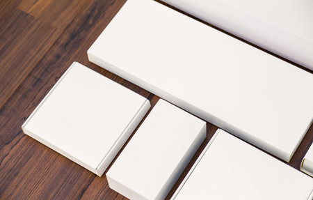 Blank white box mock up on wood background