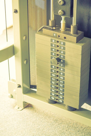 Fitness center with traineger equipments  ( Filtered image processed vintage effect. )