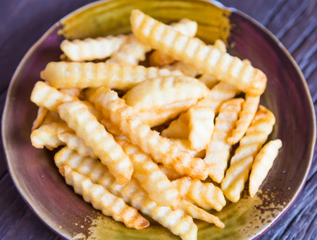 French fries on wood table