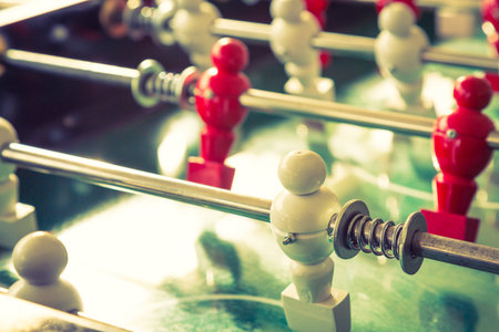 Football table game with red and white player ( Filtered image processed vintage effect. )