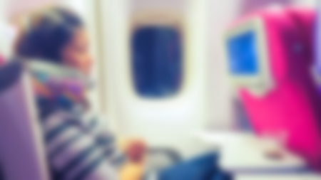 Abstract blur woman in the interior of the airplaneの写真素材