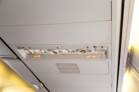 No smoking sign and seat belt sign on the airplaneの写真素材