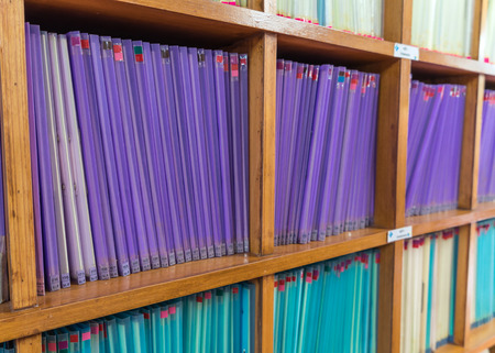 Documents aligned on the shelfの写真素材