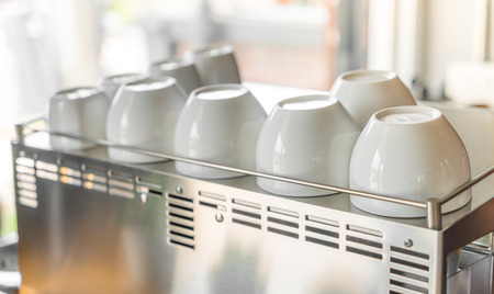 Empty coffee cup on coffee machineの写真素材