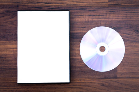 Blank compact disc with cover on wood background groundの写真素材
