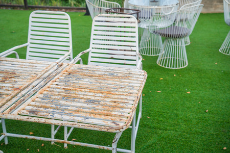 Chairs sitting on grassの写真素材