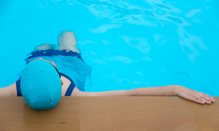 Woman relaxing on the swimming poolの写真素材