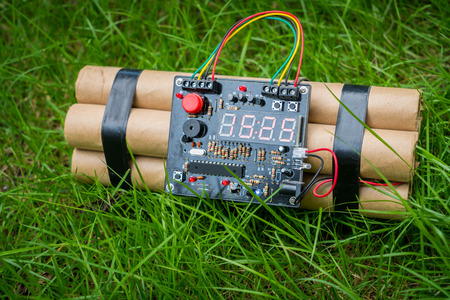 TNT time bomb on grass  ( Filtered image processed vintage effect. )の写真素材