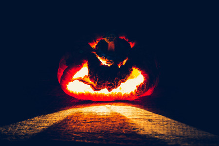 Halloween scary face pumpkin ( Filtered image processed vintage effect. )の写真素材