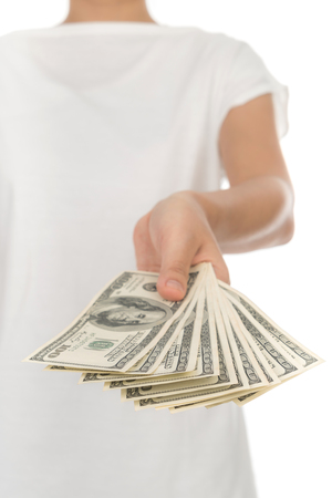 Hand with dollars isolated on white backgroundの写真素材