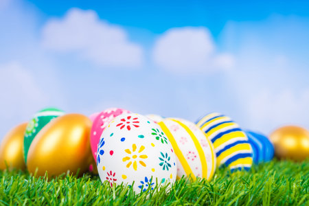 Easter Eggs on Fresh Green Grass over blue sky