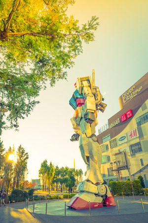 Full size Gundam Performances Outside DiverCity Tokyo Plaza, Odaiba, Tokyo, Japan - 27 November 2015: It is 18m tall The sculpture of famous anime franchise robot, Gundam.のeditorial素材