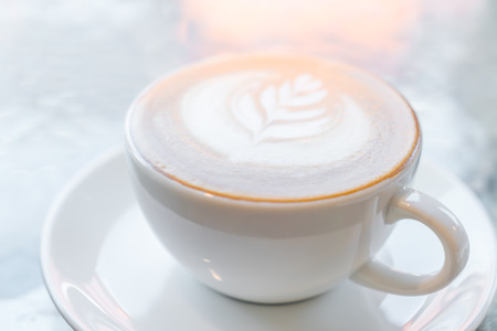 Latte Coffee art on the tableの写真素材