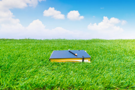 Notebook on spring green grass
