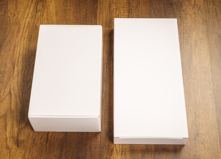 Blank white box mock up on wood backgroundの写真素材