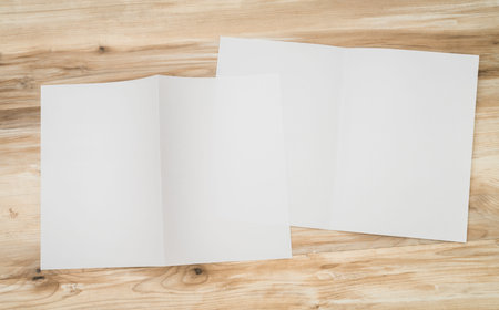 Bifold white template paper on wood texture