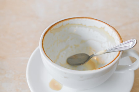 Empty cup of coffee on table