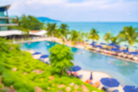 Abstract blur Swimming pool with relaxing seats near beachの写真素材