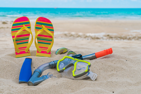 Scuba Diving Equipment On The White Sea Sand Beachの写真素材
