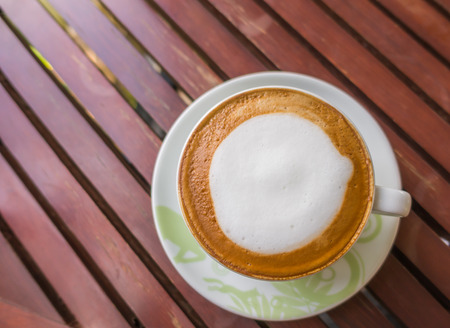 Latte Coffee on the wooden tableの写真素材
