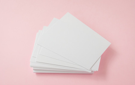 Blank business card on pink backgroundの写真素材