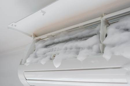 Air conditioner cleaning with washing foamの写真素材
