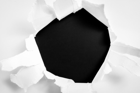 Torn paper on black backgroundの写真素材