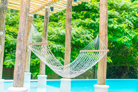 White hammocks in Luxury swimming poolの写真素材