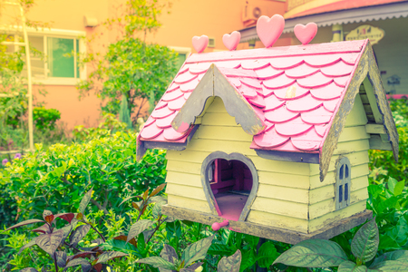 Wooden bird house in parkの写真素材