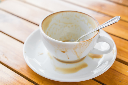 Empty cup of coffee on wooden tableの写真素材