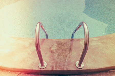 Swimming pool with stairs ( Filtered image processed vintage effect. )の写真素材
