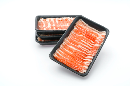 Slide of  raw pork  on white backgroundの写真素材
