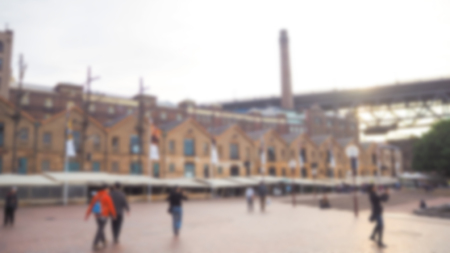 Abstract blur Crowd of anonymous people walking on busy  streetの写真素材