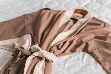Clean bathrobe  on bedの写真素材