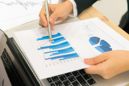 Business people using laptop and Financial charts at meeting officeの写真素材