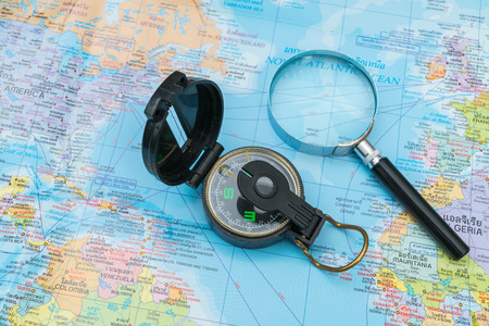 Travel preparation : compass,sunglasses,magnifying glass on road mapの写真素材
