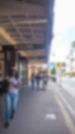 Abstract blur Crowd of anonymous people walking on busy  streetの写真素材