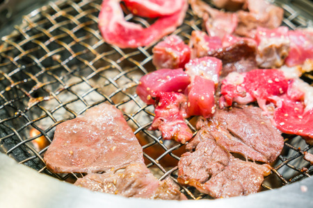 Japanese style Raw fresh beef on hot barbecue grillの写真素材