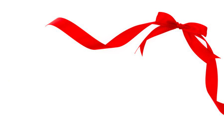 Shiny red ribbon on white background with copy spaceの写真素材