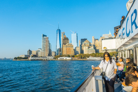 New York City - October 18, 2016:  Tourists viewing Statue of Liberty from the Circle Line boat tour of Ellis Island, New York, New Yorkのeditorial素材