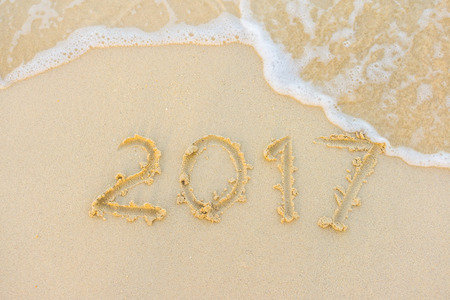 2017 text with white sandy beach and seaの写真素材