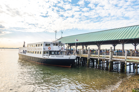 New York City - October 18, 2016:  Crowd of tourists awaiting to take a boat to Ellis Island.のeditorial素材