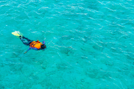 Snorkeling in tropical Maldives island